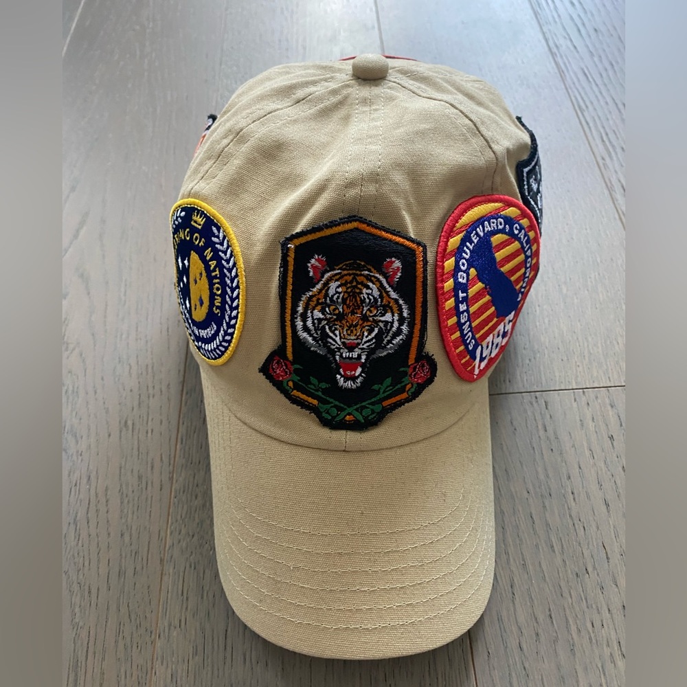 CRIMINAL DAMAGE. Adjustable Cream Coloured Hat with stitched decals.